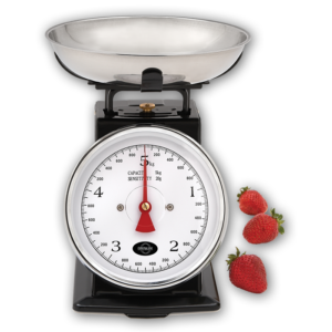 A mechanical kitchen scale with a black frame and a chrome accent around the dial, a large dial with easy-to-read black numbers that measure in both metric and imperial, a red needle, and a 24oz removable measuring bowl that sits on top of the frame.